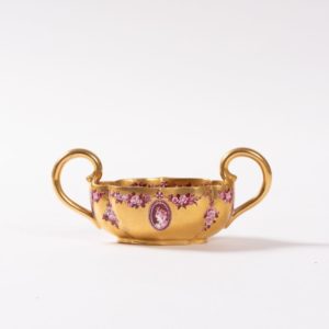 Coalport richly gilt Loving Cup with two extended handles and red “cameo heads” decoration. Date 1890