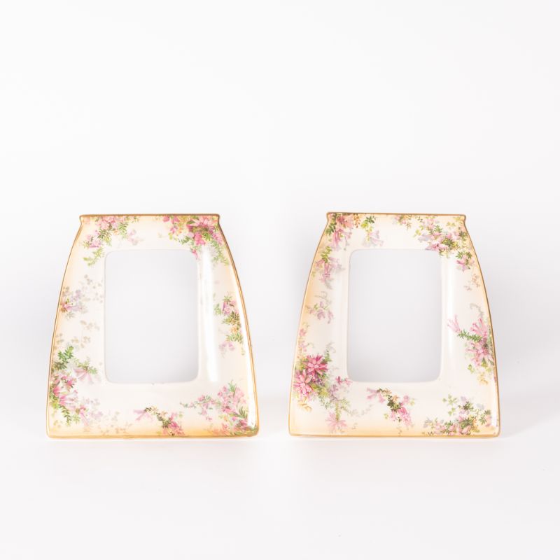 Pair Doulton porcelain photo frames